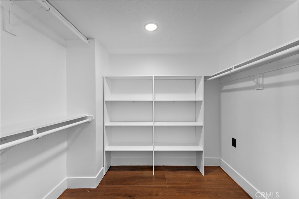 11 Bayside Irvine, CA 92614 - Photo 28 of 37 a room with walk in closet and wooden floor