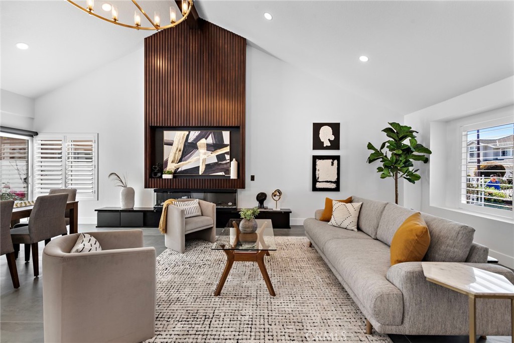 11 Bayside Irvine, CA 92614 - Photo 4 of 37 a living room with furniture and a large window