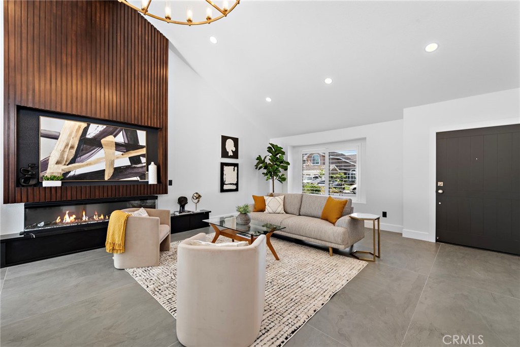 11 Bayside Irvine, CA 92614 - Photo 5 of 37 a living room with furniture and a flat screen tv