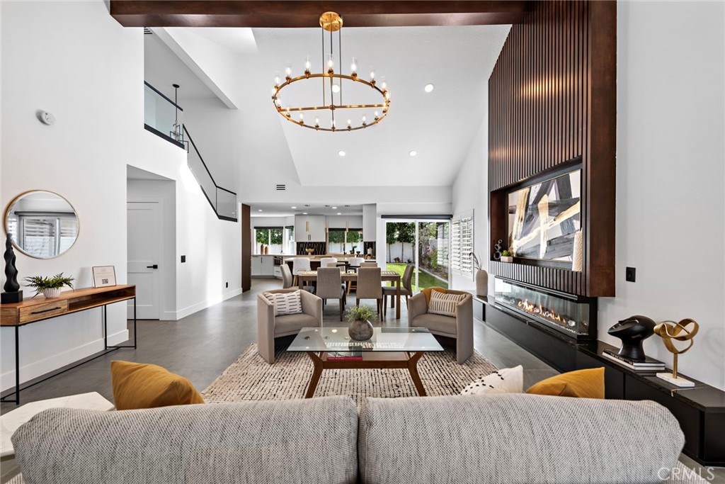 11 Bayside Irvine, CA 92614 - Photo 7 of 37 a living room with fireplace furniture and a flat screen tv