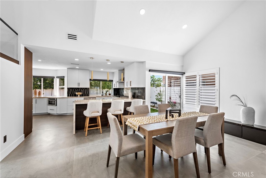 11 Bayside Irvine, CA 92614 - Photo 8 of 37 a view of a dining room with furniture and wooden floor