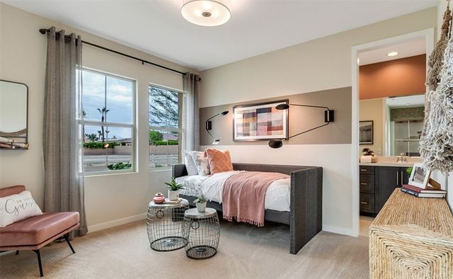 a bedroom with a bed and a couch