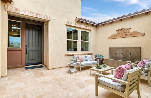 a outdoor living space with furniture and a rug
