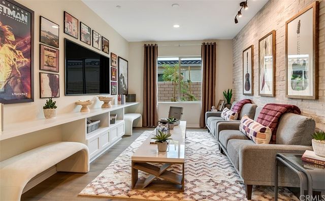 a living room with furniture fireplace and a flat screen tv