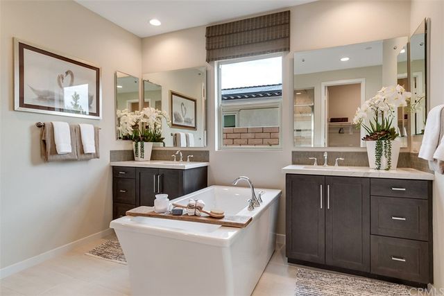 a room with a sink cabinets and wooden floor