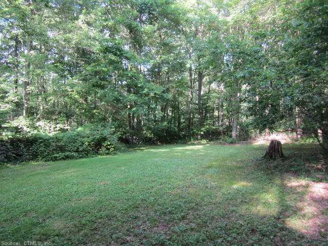 Land. Looking east towards rear of lot-N stonewall on the left