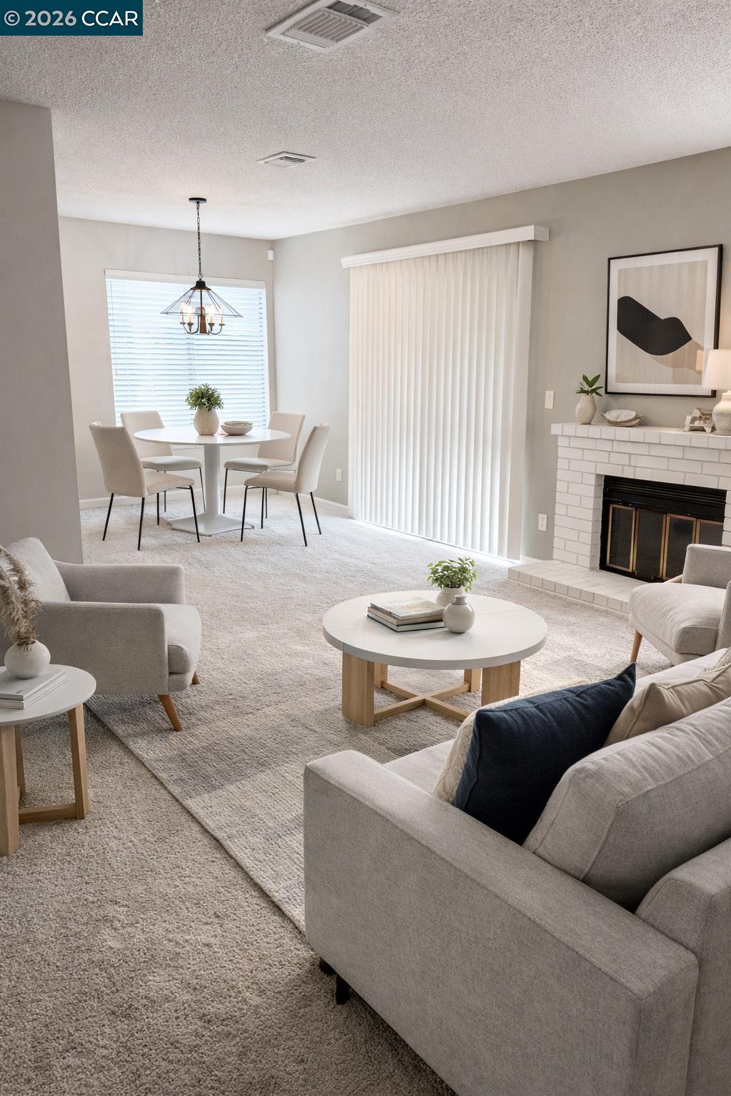 801 Dover Hercules, CA 94547 - Photo 3 of 19 a living room with furniture a fireplace and a table