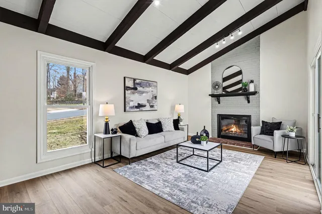 a living room with furniture and a rug