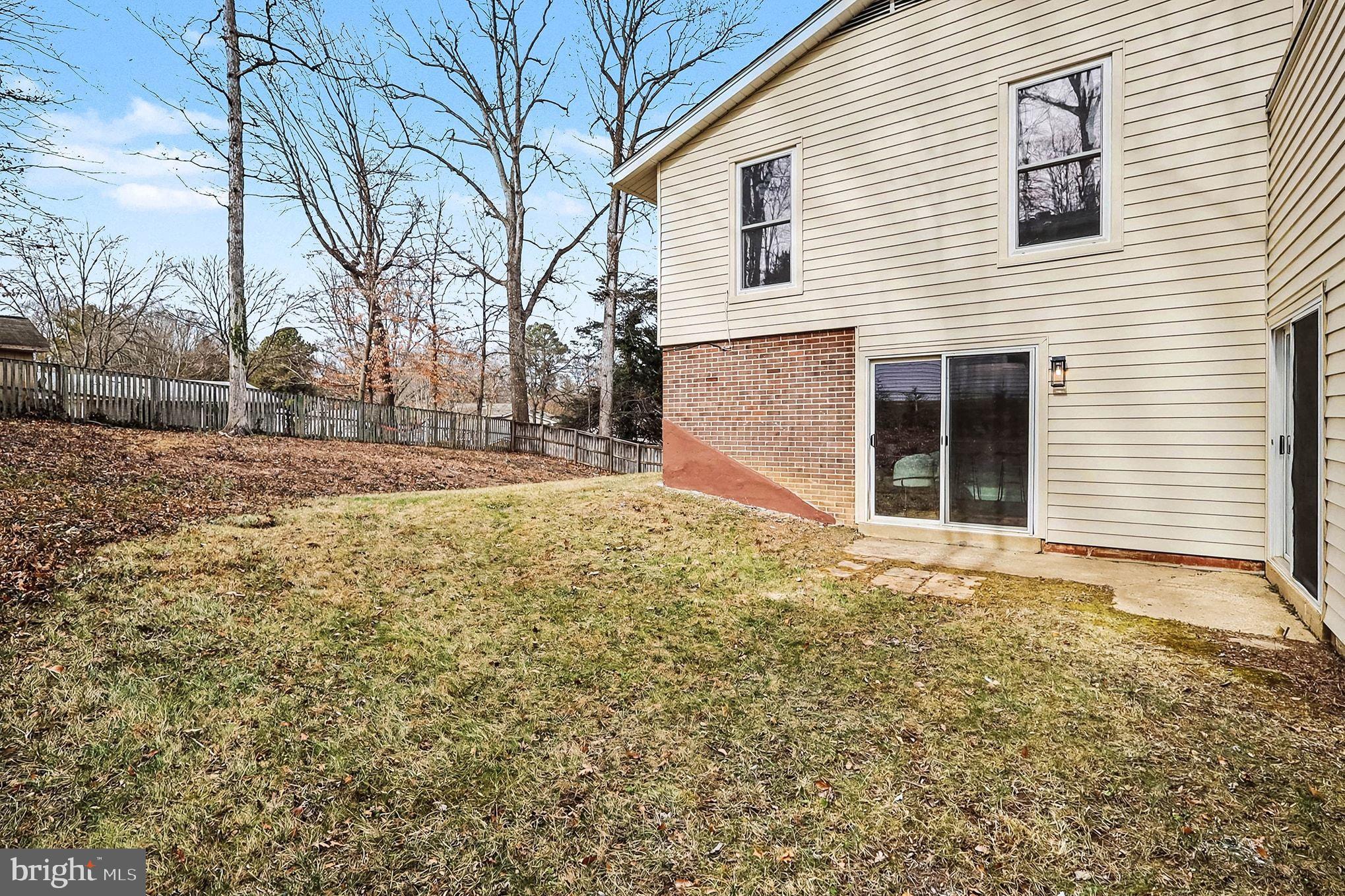 6214 Garretson Street Burke, VA 22015 - Photo 21 of 27 a view of a backyard of the house