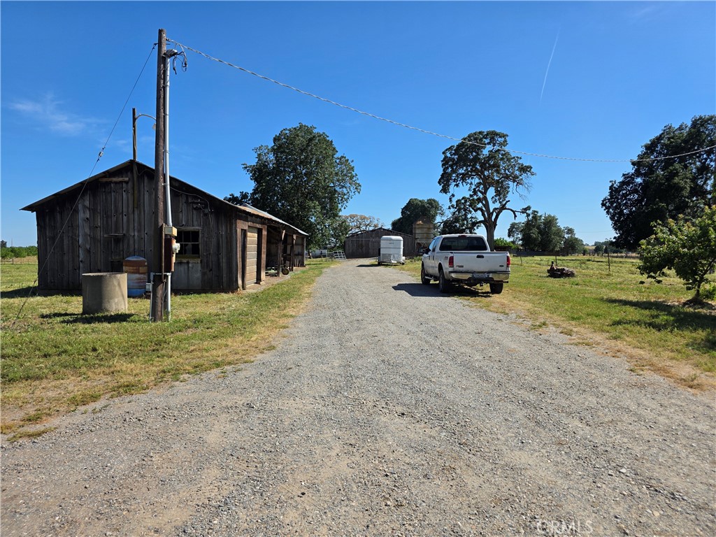 23773 River Road Corning, CA 96021 - Photo 44 of 64 a view of a house with a yard and garage