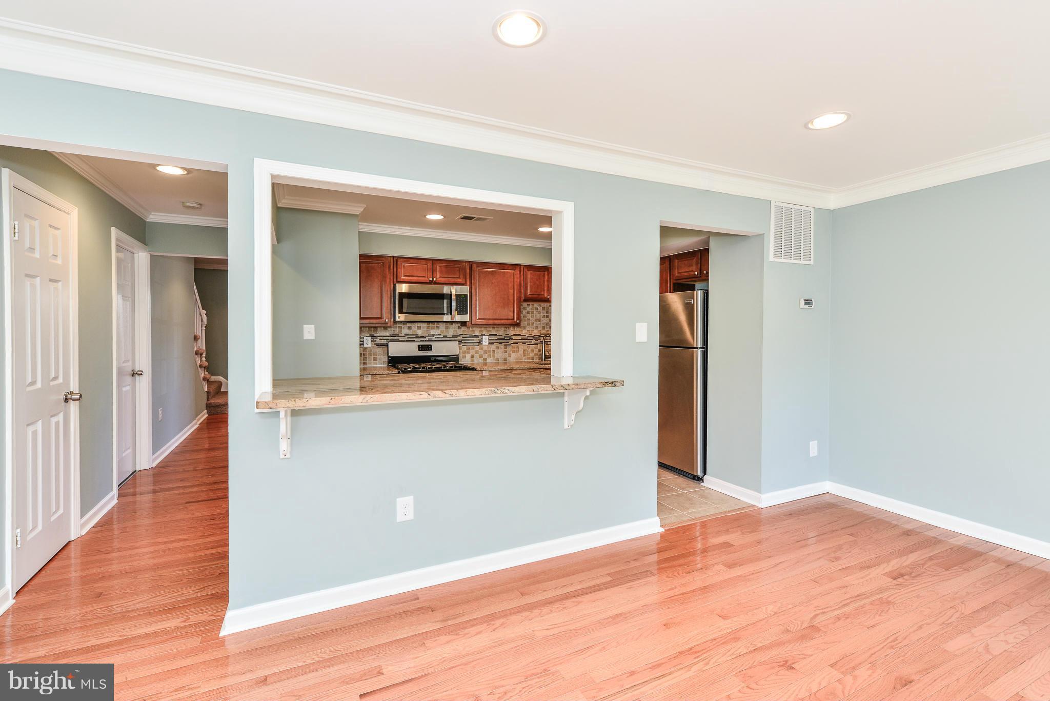 2407 Alsop Court Reston, VA 20191 - Photo 11 of 30 a view of kitchen and kitchen with wooden floor