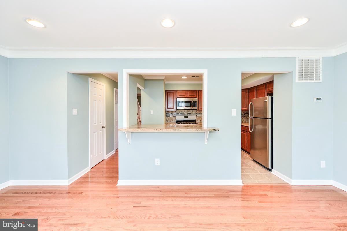 2407 Alsop Court Reston, VA 20191 - Photo 16 of 30 a view of a living room with wooden floor