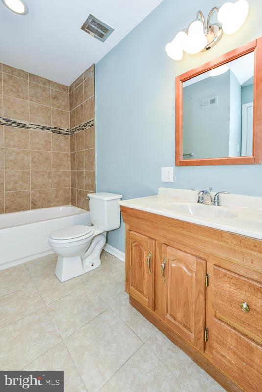 2407 Alsop Court Reston, VA 20191 - Photo 20 of 30 a bathroom with a sink toilet and shower