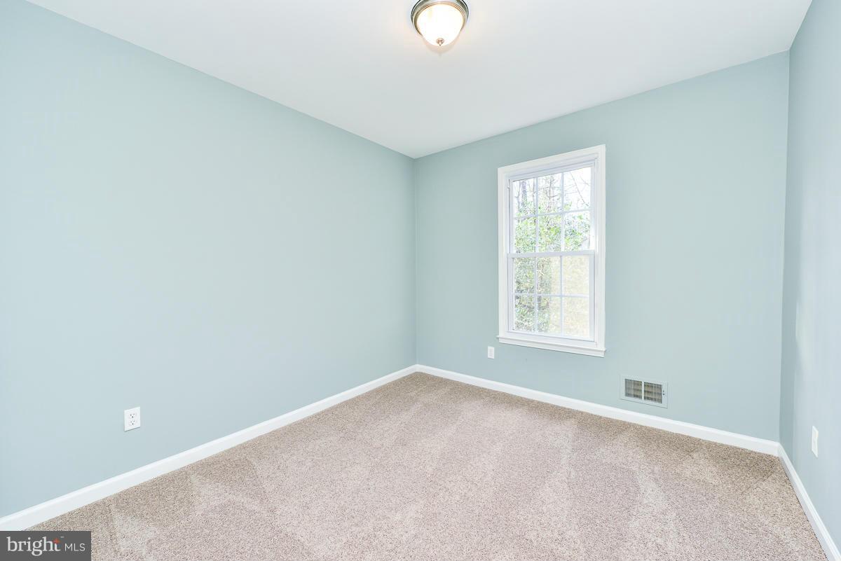 2407 Alsop Court Reston, VA 20191 - Photo 21 of 30 a view of an empty room with a window