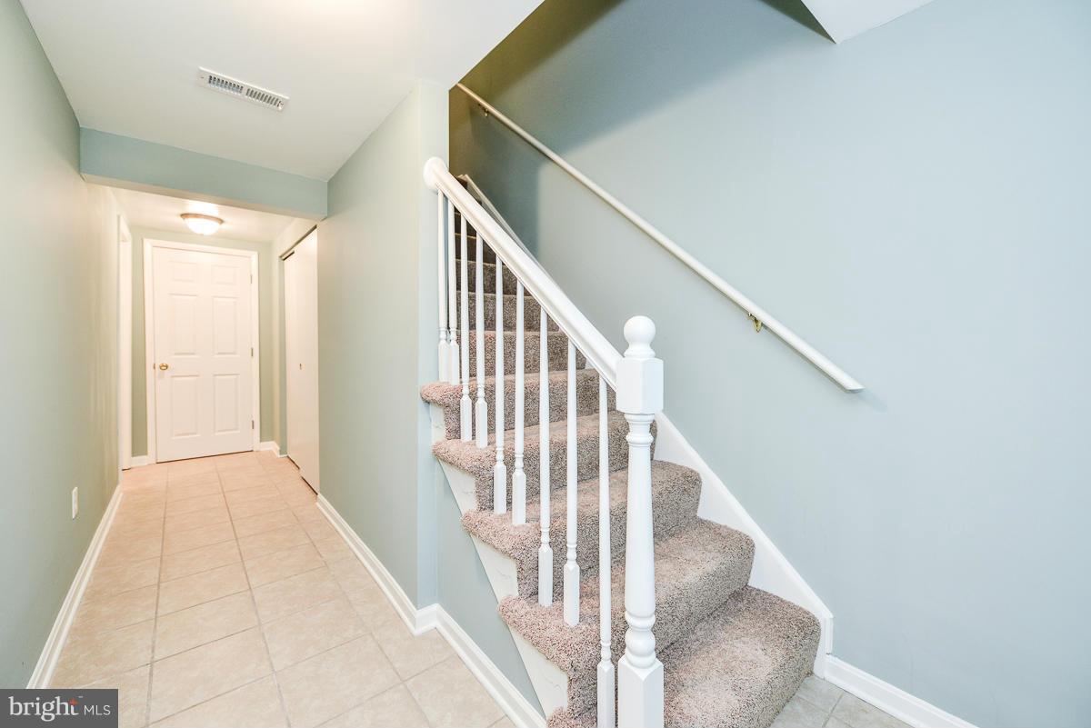 2407 Alsop Court Reston, VA 20191 - Photo 27 of 30 a view of entryway and hall with wooden floor