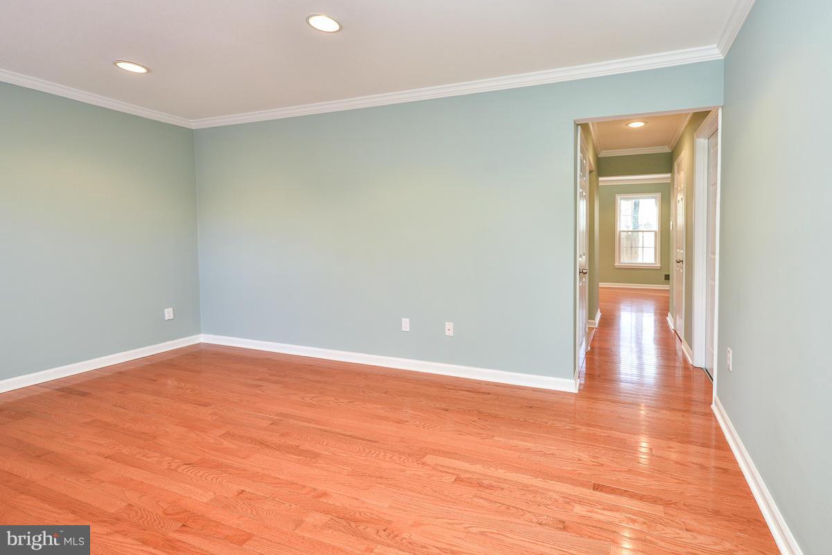 2407 Alsop Court Reston, VA 20191 - Photo 29 of 30 a view of an empty room with wooden floor