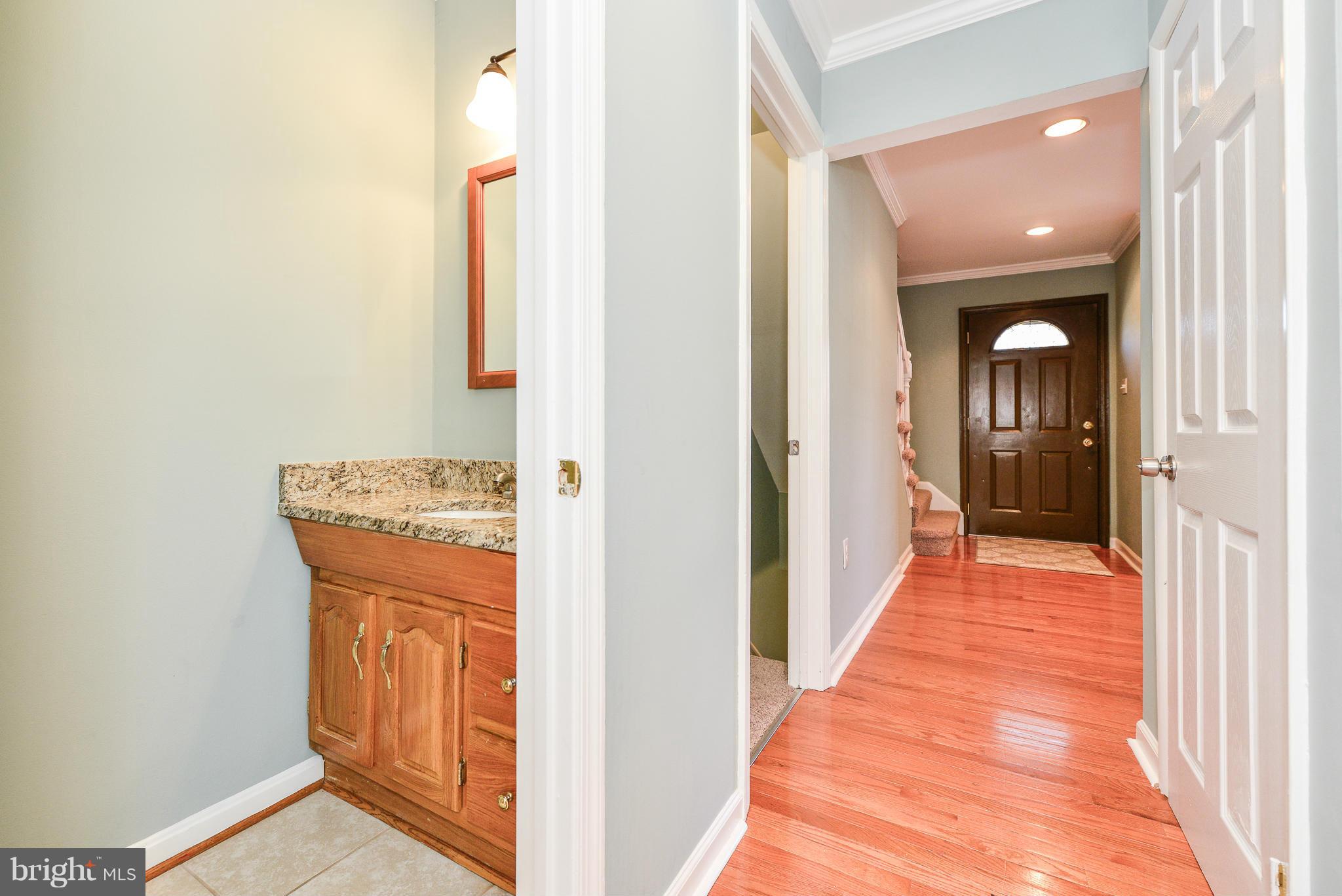 2407 Alsop Court Reston, VA 20191 - Photo 8 of 30 a view of a hallway with wooden floor