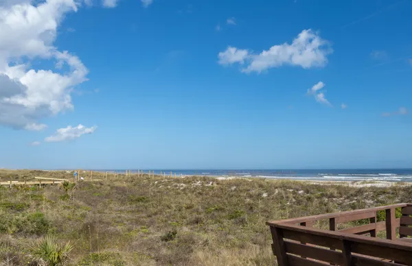 a view of balcony with wooden floor
