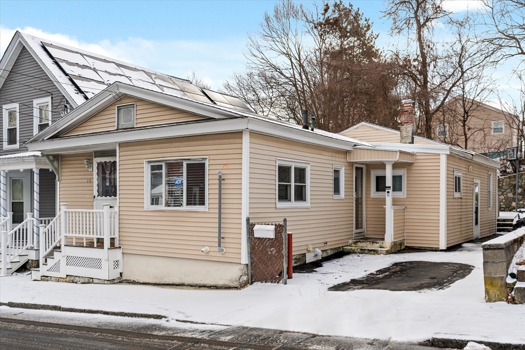 116 Weare Street Lawrence, MA 01843 - Photo 23 of 25 a view of a white house with a sink and yard