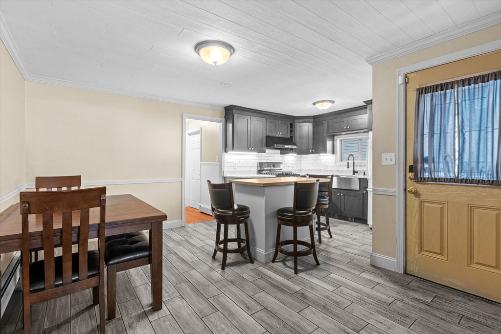 116 Weare Street Lawrence, MA 01843 - Photo 3 of 25 a living room with stainless steel appliances furniture a dining table and chairs
