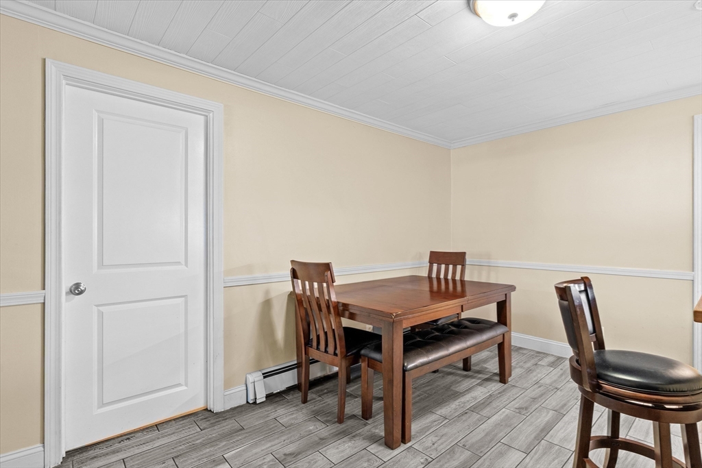 116 Weare Street Lawrence, MA 01843 - Photo 5 of 25 a view of a workspace with furniture and wooden floor
