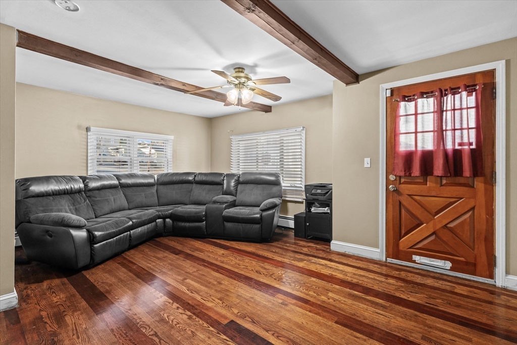 116 Weare Street Lawrence, MA 01843 - Photo 6 of 25 a living room with furniture a ceiling fan and a window