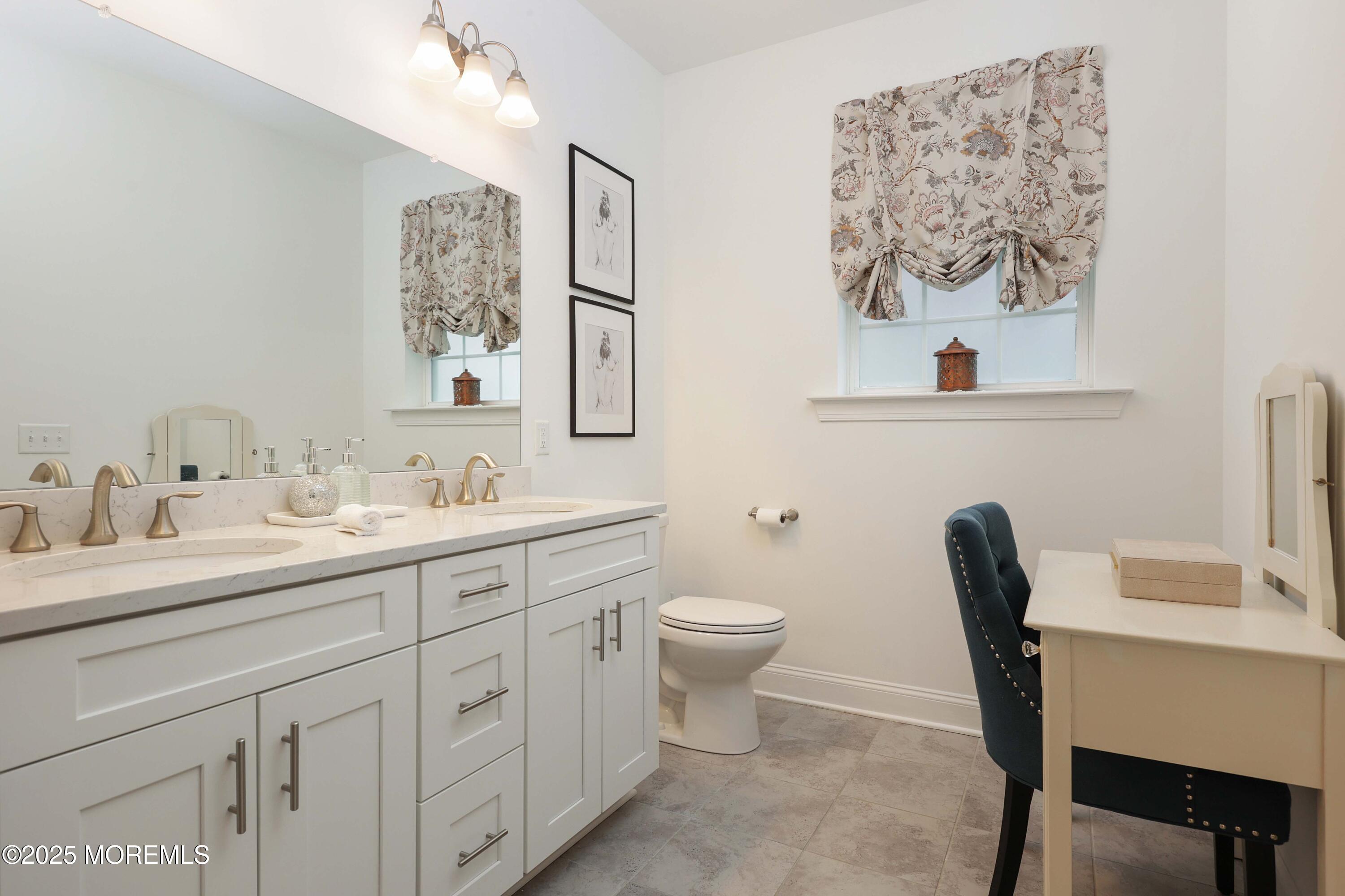 152 Edenton Drive Barnegat, NJ 08005 - Photo 23 of 36 a bathroom with a toilet sink and mirror