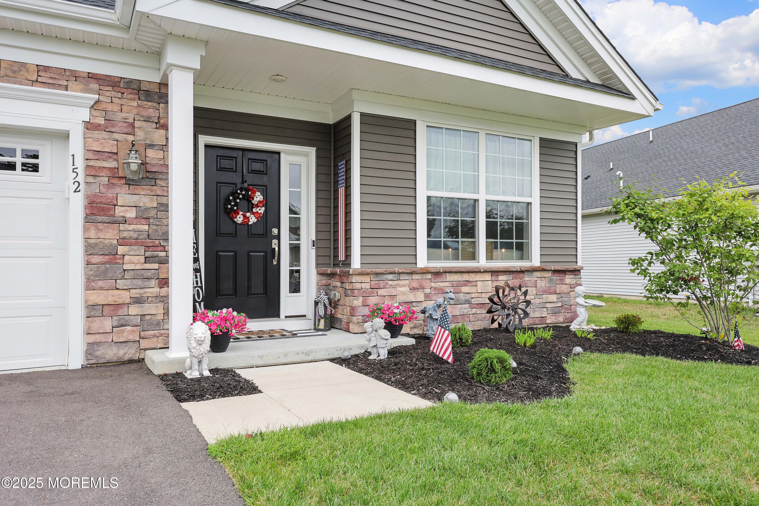 152 Edenton Drive Barnegat, NJ 08005 - Photo 3 of 36 a front view of a house with a yard