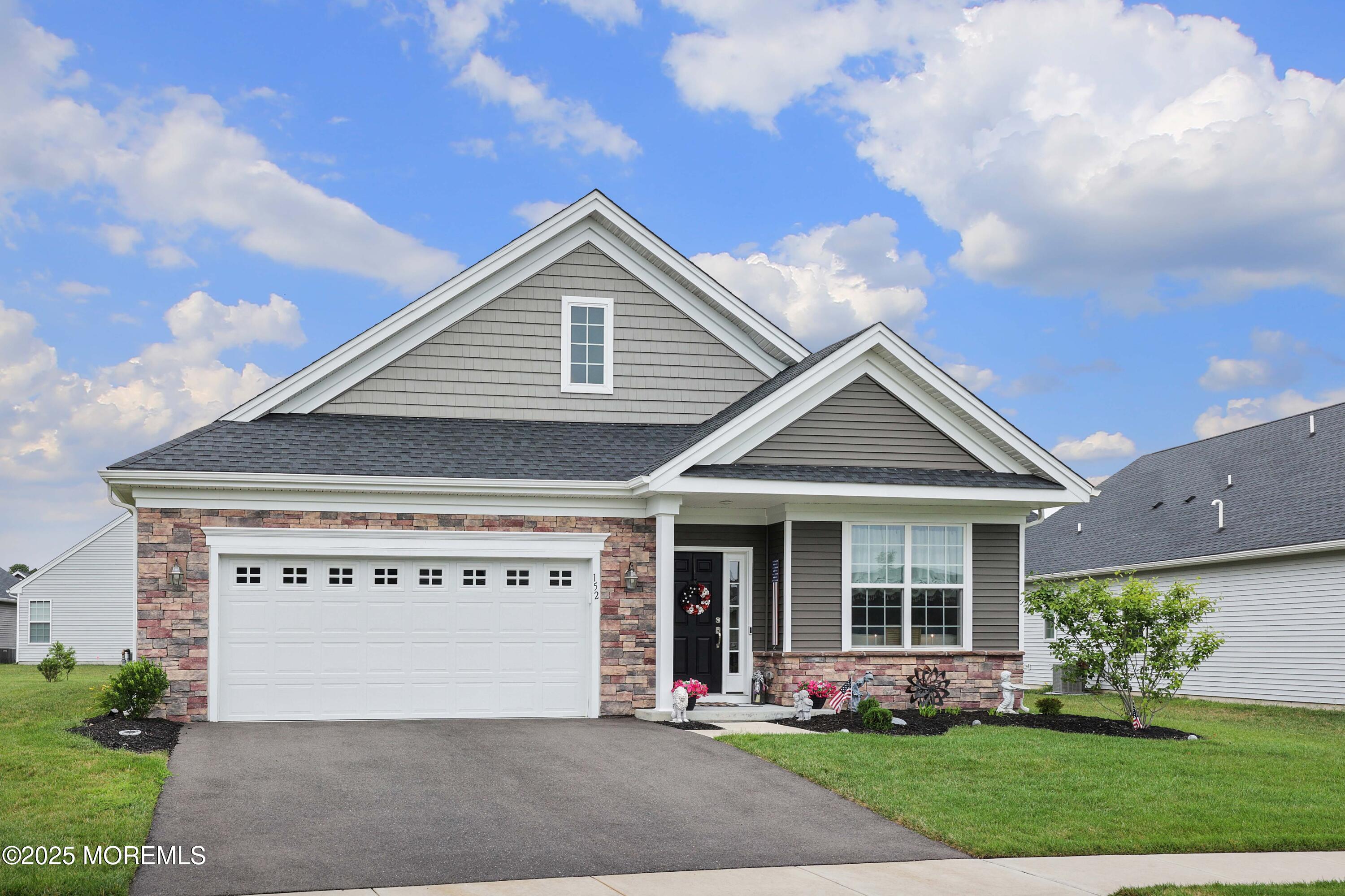 152 Edenton Drive Barnegat, NJ 08005 - Photo 34 of 36 a front view of a house with garden