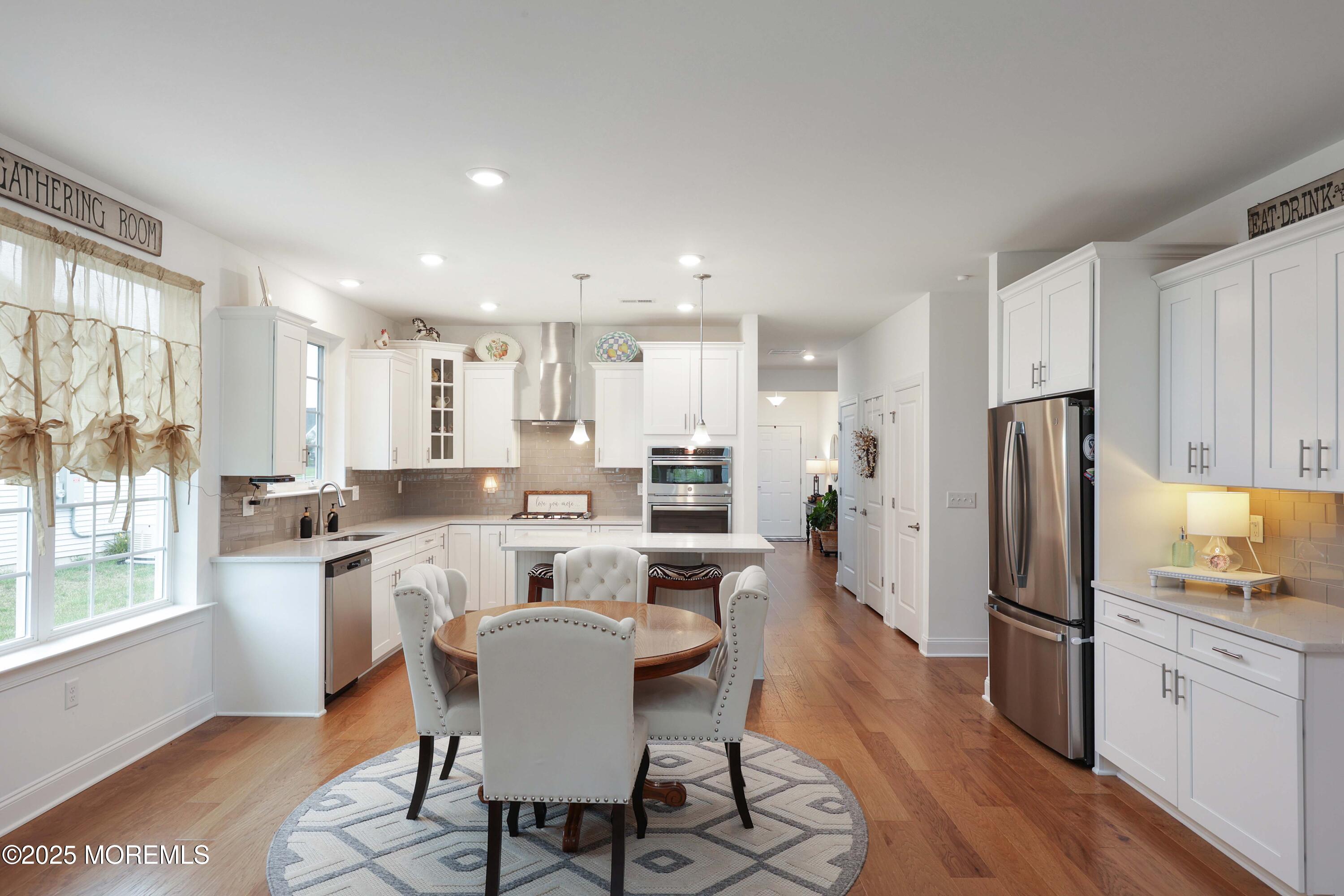 152 Edenton Drive Barnegat, NJ 08005 - Photo 8 of 36 a kitchen with kitchen island wooden cabinets and stainless steel appliances