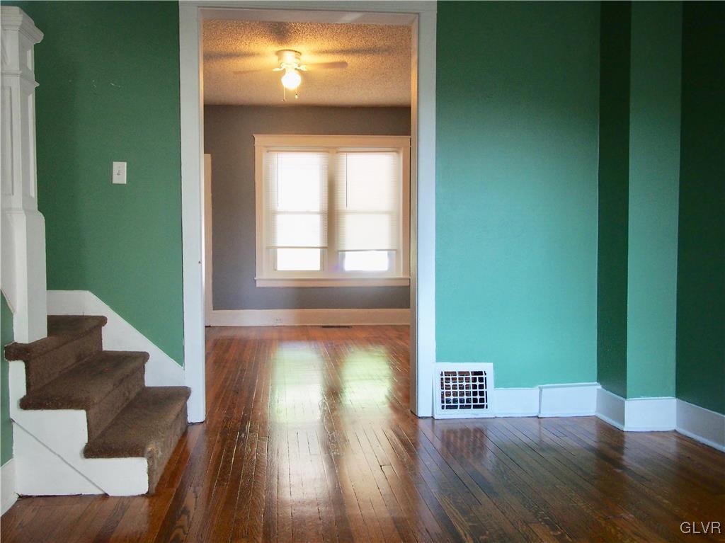1021 Spring Street Bethlehem, PA 18018 - Photo 3 of 14 a view of an empty room with wooden floor and a window