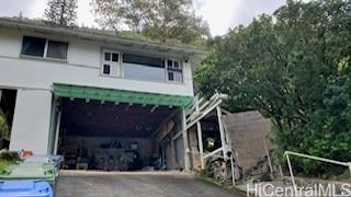 3063 Woolsey Place Honolulu, HI 96822 - Photo 1 of 1 a front view of a house with a garage