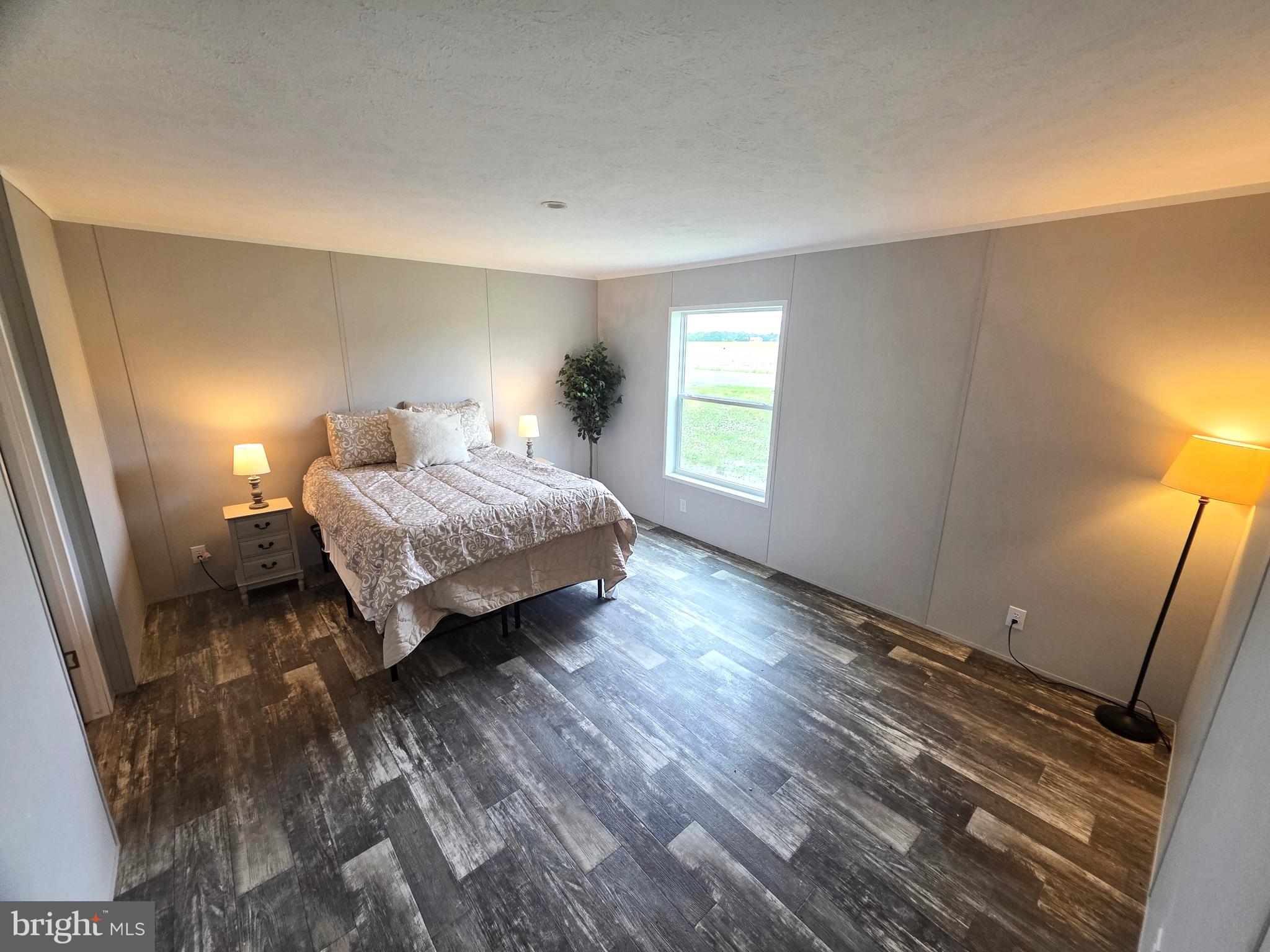 289 Grove Neck Road Earleville, MD 21919 - Photo 8 of 19 a spacious bedroom with a bed and a window