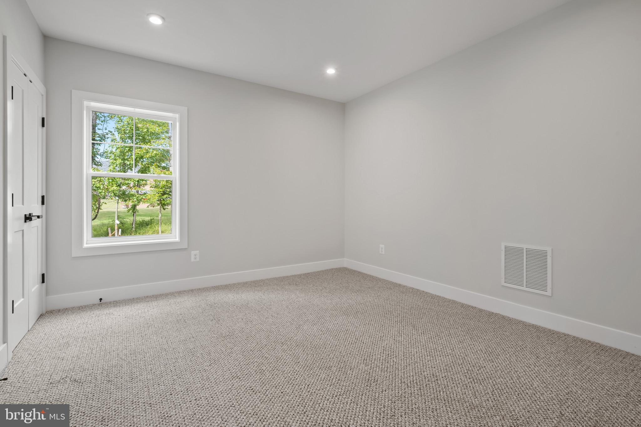 11516 Smithfield Road Manassas, VA 20112 - Photo 21 of 38 an empty room with a window