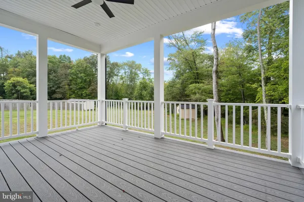 a view of balcony with wooden floor