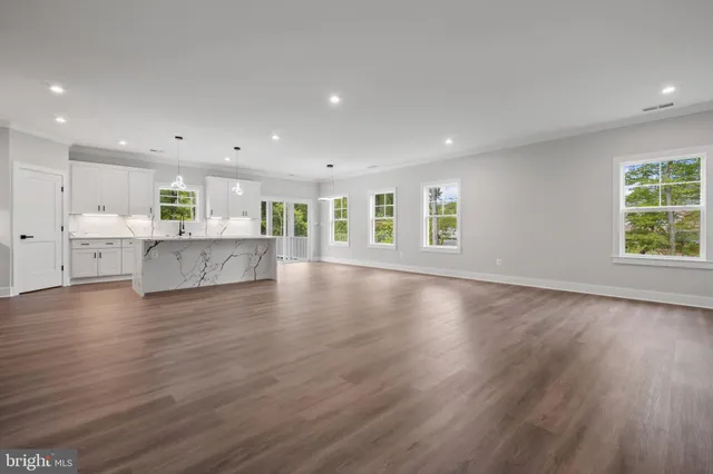 a view of kitchen with furniture and wooden floor