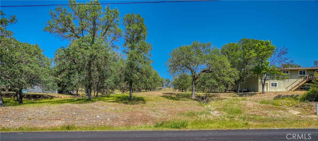 19136 Redbud Road Hidden Valley Lake, CA 95467 - Photo 1 of 1 a view of a yard with basketball court