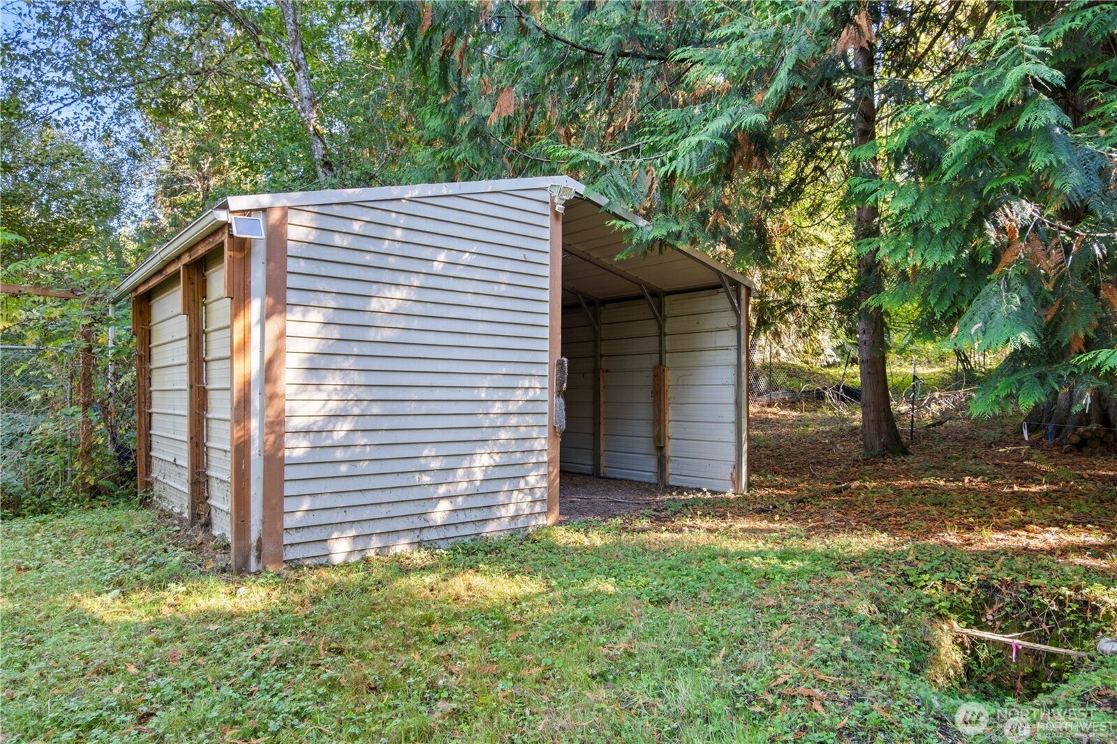 14310 200th Avenue Southeast Renton, WA 98058 - Photo 24 of 39 a backyard of a house with lots of green space