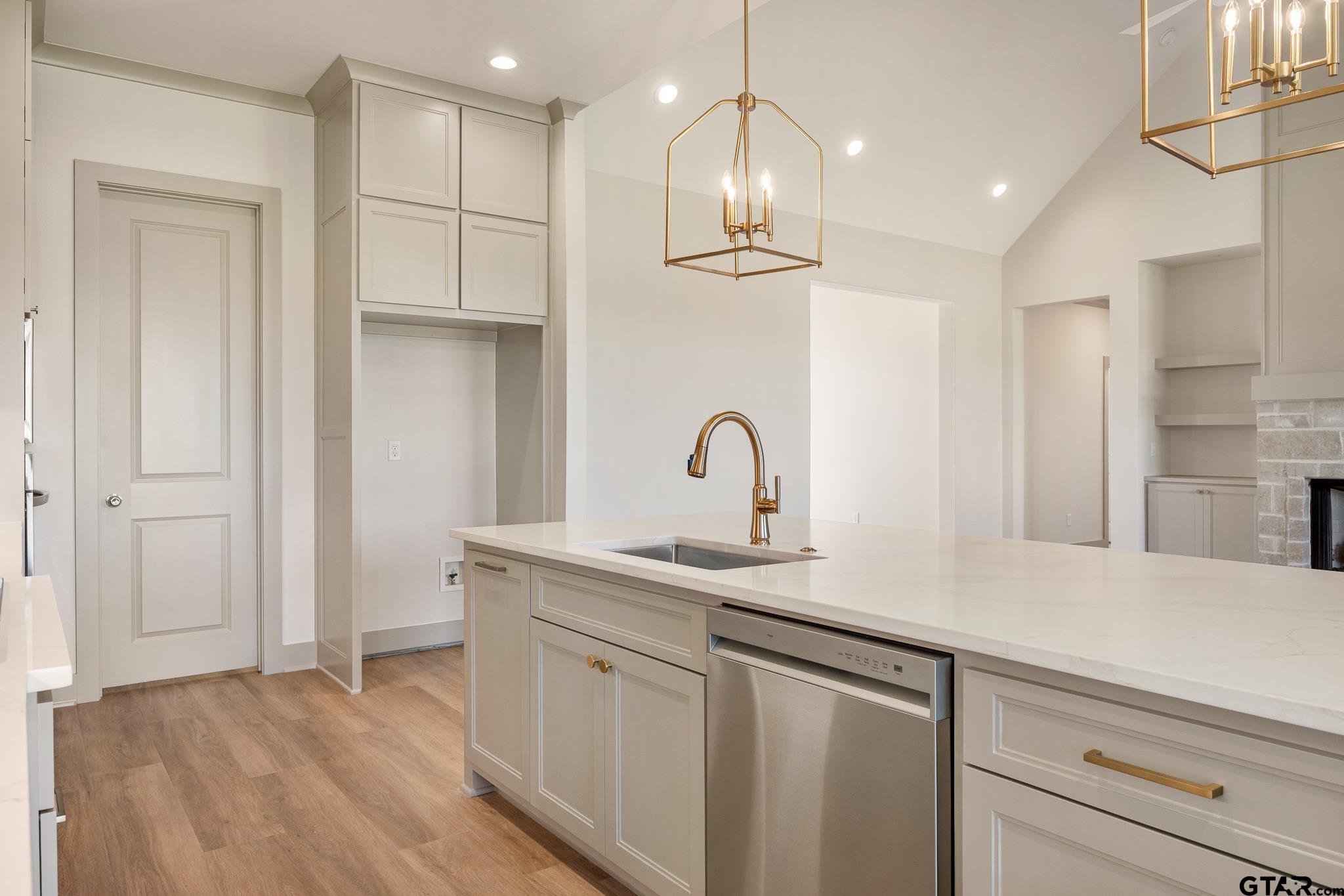 508 Artesian Meadow Drive Bullard, TX 75757 - Photo 17 of 46 a kitchen with white cabinets and sink