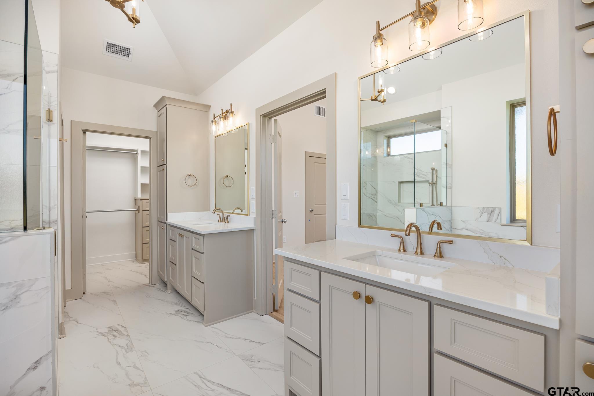 508 Artesian Meadow Drive Bullard, TX 75757 - Photo 27 of 46 a bathroom with a sink vanity granite tub shower and a mirror