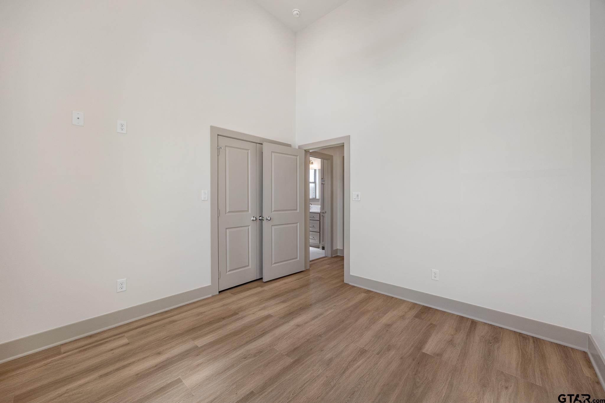 508 Artesian Meadow Drive Bullard, TX 75757 - Photo 32 of 46 a view of an empty room with wooden floor