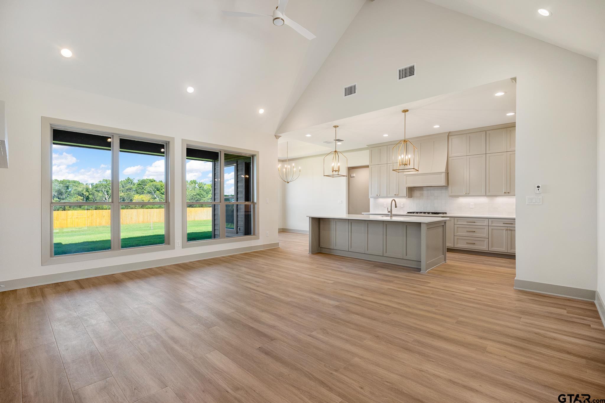 508 Artesian Meadow Drive Bullard, TX 75757 - Photo 10 of 46 a view of kitchen with wooden floor and windows