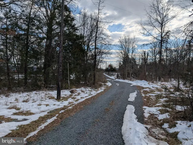 a view of a yard covered in snow