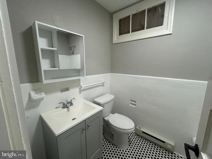1630 16th Street Southeast, Unit 2 Washington, DC 20020 - Photo 13 of 15 a bathroom with a sink toilet and vanity