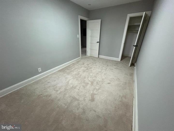 1630 16th Street Southeast, Unit 2 Washington, DC 20020 - Photo 5 of 15 an empty room with windows