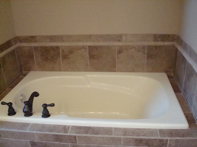 1646 Belclare Road Normal, IL 61761 - Photo 6 of 6 a bathroom with a bathtub