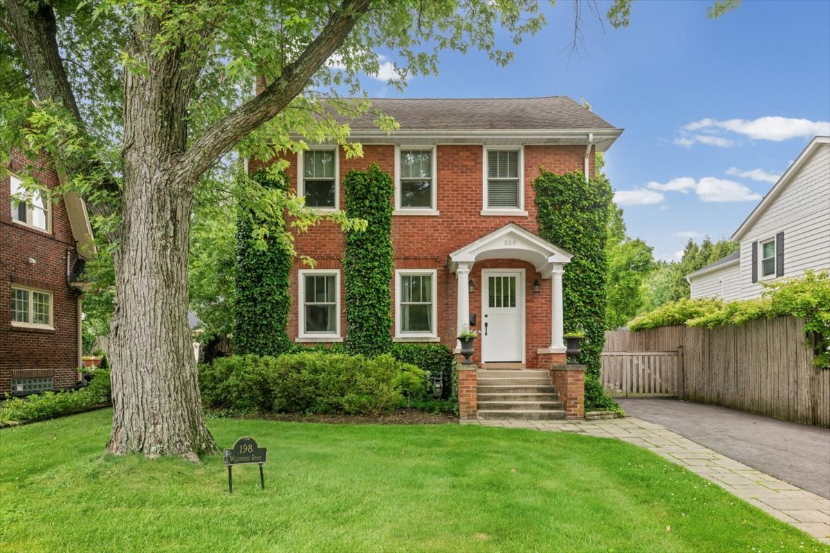 198 Wildwood Road Lake Forest, IL 60045 - Photo 2 of 37 a front view of a house with a yard