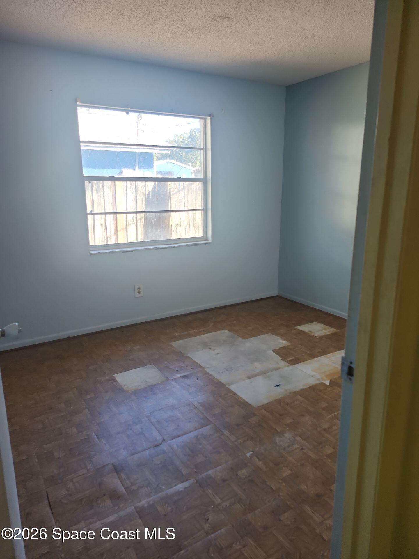 2972 Matthew Drive Rockledge, FL 32955 - Photo 17 of 24 an empty room with a window