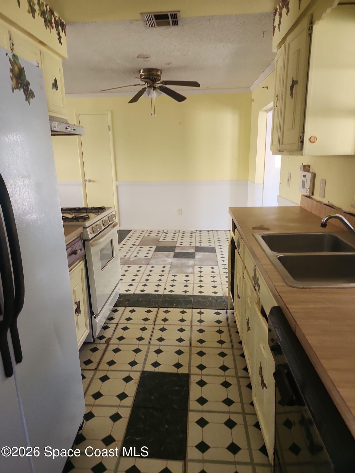 2972 Matthew Drive Rockledge, FL 32955 - Photo 2 of 24 a kitchen with granite countertop a stove and a sink