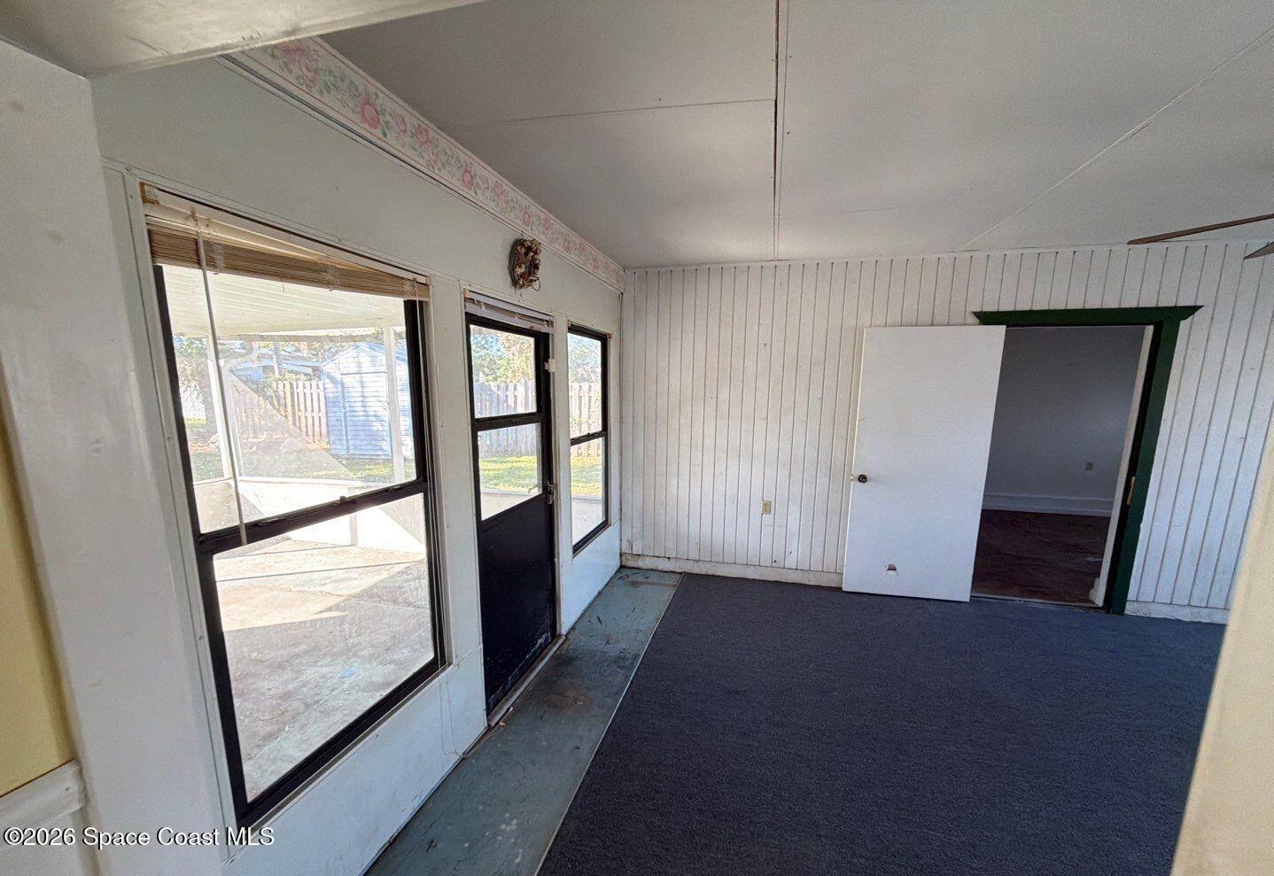 2972 Matthew Drive Rockledge, FL 32955 - Photo 6 of 24 a view of hallway with windows and wooden floor